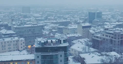 Aerial view over winter Sofia with snowy buildings and roofs Stock-Footage 297781491