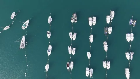 Aerial view of an overhead view of numerous boats and yachts moored in neat rows Stock Footage 346665433