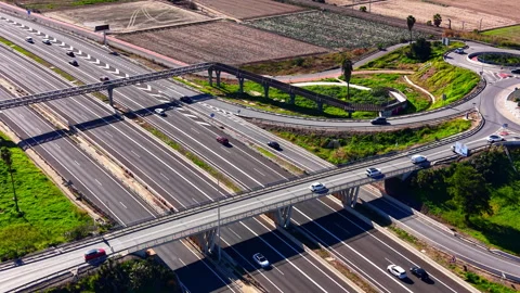 Aerial view of overlapping highway bridges and roundabout, Spain Видео 344693838