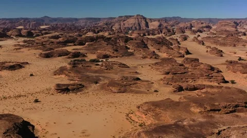 Aerial view overlooking raw desert nature and sandstone cliffs, in Hegra, Stock Footage 217353575