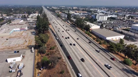 Aerial view overlooking traffic on the 405 Freeway, on a sunny day, In Los Stock Footage