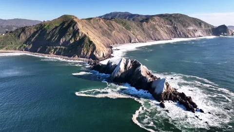 Aerial view of Pacific Ocean waves crashing against Devil Slide rock format.. Stock Footage 337633940