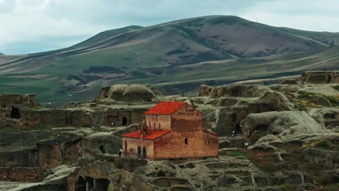 Aerial view of the pagan temples and Christian basilica within the Uplistsikhe Stock Footage 335476964