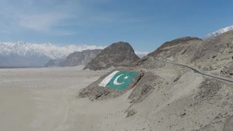 Aerial view of a Pakistani flag painted on a rock formation in a desert 스톡 동영상 314457092