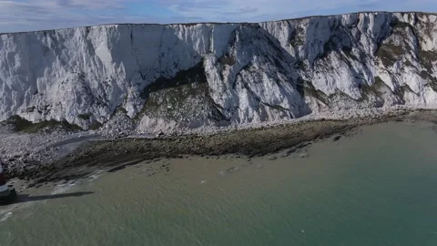 Aerial view Pan of Beachy Head Cliff face and Lighthouse Stock Footage 148058936