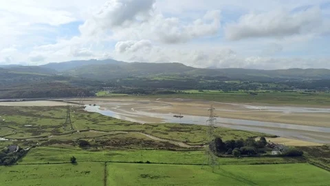 Aerial view, pan move. Drone panorama of sea bay during low tide in Wales Video stock 94228873