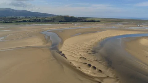 Aerial view, pan move. Drone panorama sea sand during low tide in Portmeirion Video stock 94236898