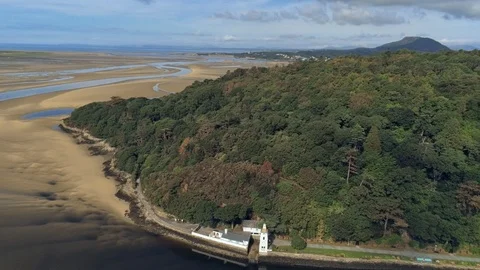 Aerial view, pan move. Drone panorama of lighthouse on cape in Portmeirion, S Video stock 94237064