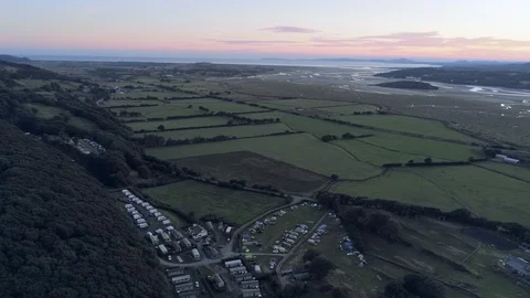 Aerial view, pan move. Drone panorama sunset over hills, Snowdonia mountains  Stock Footage 94248366