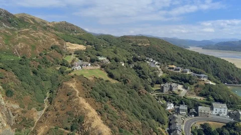 Aerial view, pan move. Drone panorama over sea, hills and buildings, Barmouth 스톡 동영상 94251279