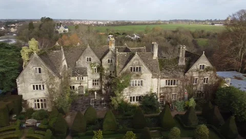 Aerial view, panning move. Surrounding of an old abbey in Malmsbury, England Stockbeeldmateriaal 138208615