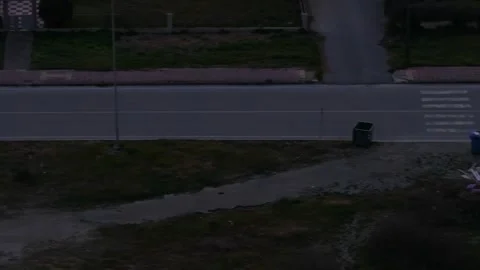 Aerial View Panning Over Quiet Suburban Street with Pickup Truck Passing in Stock Footage 342470741