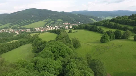 Aerial View. Panorama. Flight over a green grassy in mountains Stock Footage 64252990