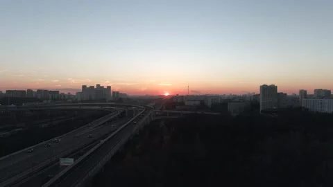 Aerial view panorama of multi-level transport interchange in the city at dawn Stock Footage 143370797