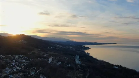 Aerial view panoramic hyperlapse sunrise over mountains on the seashore Video stock 125906658