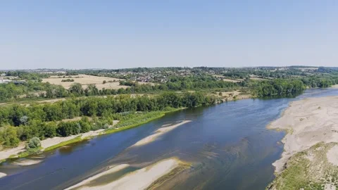 Aerial view of a panoramic view of the Loire river winding through lush green Stock Footage 346723024