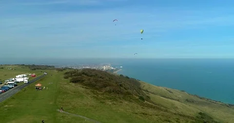 Aerial view of para gliders at Beachy Head, Southern England Stock Footage 80872435