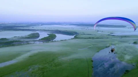 Aerial view of a paraglider in the sky Stock Footage 246246261