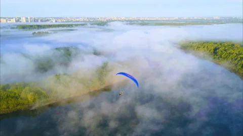 Aerial view of a paraglider in the sky Stock Footage 246247109