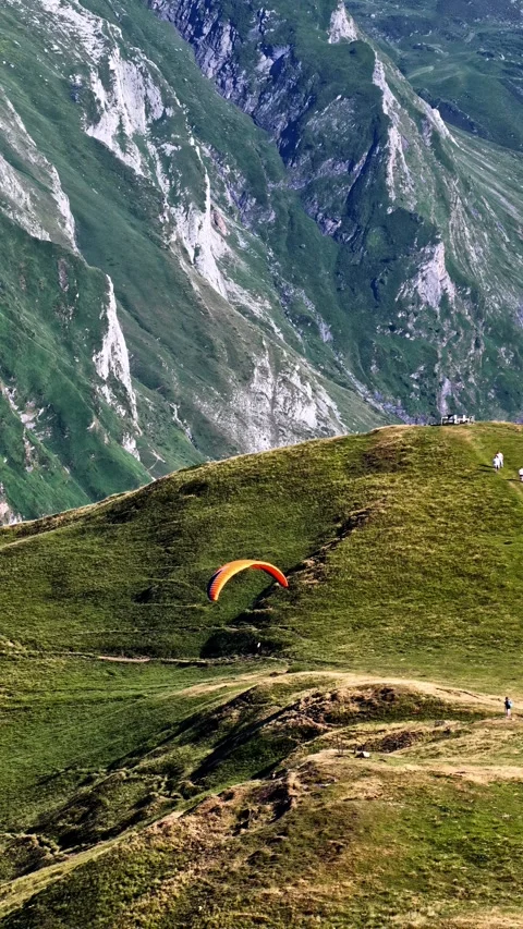 Aerial view of a paraglider soaring over Col d'Aubisque, France. Stock Footage 340263840