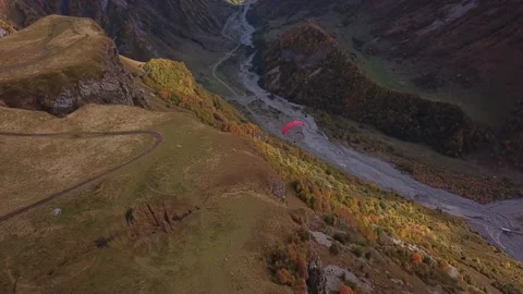 Aerial view. Paragliding through the Devil's Valley in the Caucasus mountains. Stock Footage 143208263