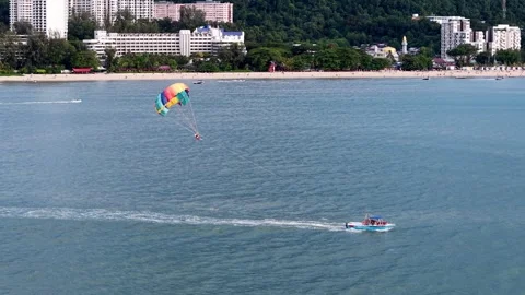 Aerial view of parasailing activity at Batu Ferringhi Beach 스톡 동영상 332096737