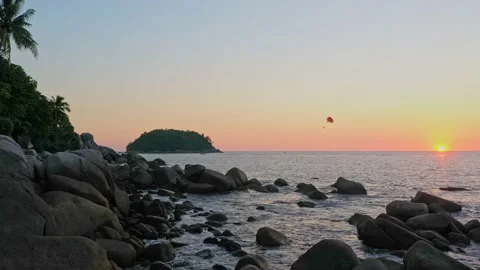 Aerial view Parasailing during sunset on the sea. 動画素材 170559672