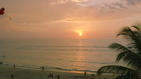Aerial view parasailing passing sunset Video stock 101087095