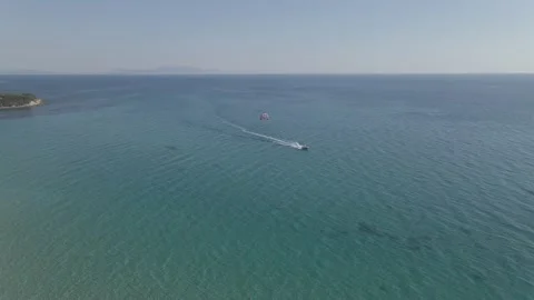 Aerial view parasiling extreme water sports in vrachos lout beach preveza greece Stock Footage 138072037