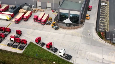 Aerial view parcel post distribution trucks logistics lorry parked at Stock Footage 162259433