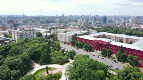 Aerial view of the park area with trees and the roadway with cars and buildings Stock Footage 163673640