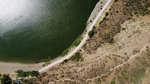 Aerial view of park path between a hill and a lake Lisi in Tbilisi Stock Footage 229879263