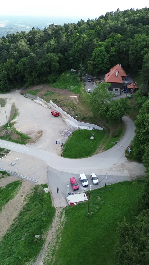 Aerial View of Parking Area Surrounded by Nature 動画素材 337023591