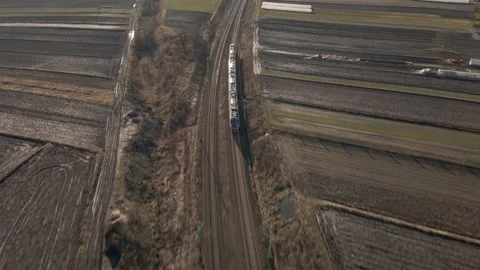 Aerial view of passanger train on a sunny day Video stock 219744506