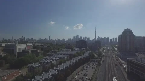 Aerial view passing train overlooking downtown Toronto in a sunny day Stock Footage 61131882