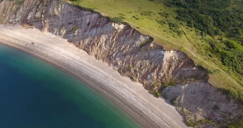 Aerial view past steep cliffs Stock Footage