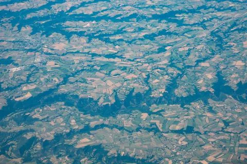 Aerial View of Patchwork Agricultural Fields and Forested Valleys Stock Photos