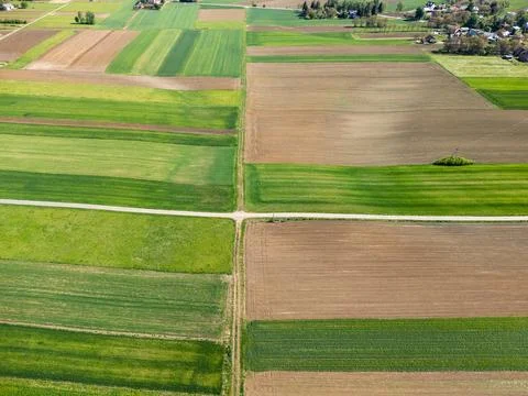 Aerial view of patchwork agricultural fields showing diverse crop rotation Stock Photos