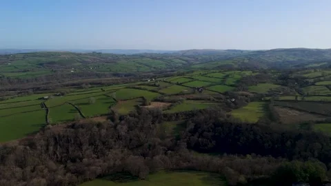 Aerial view of patchwork farmland and rolling green hills Vídeos de archivo 332620743