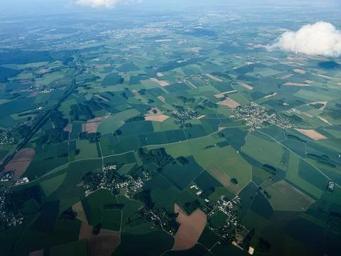 Aerial view of patchwork farmland and small villages near Paris, France wit.. Stock Photos
