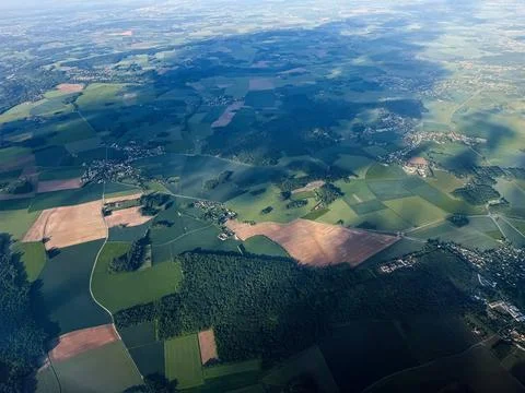 Aerial view of patchwork farmland and villages near Paris, France with fiel.. Stock Photos