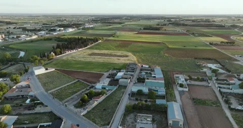 Aerial view of patchwork fields and village homes in San Clemente, Spain. Stock Footage 275940250
