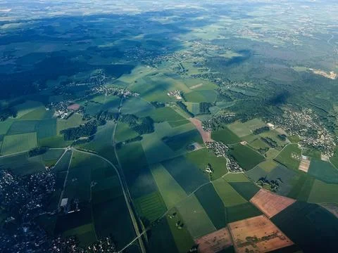 Aerial view of patchwork fields and villages near Paris, France with sunlig.. Stock Photos