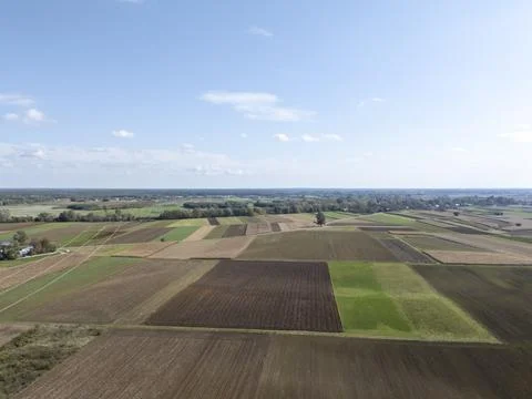 Aerial view of patchwork fields in a rural landscape with green and brown tones Stock Photos