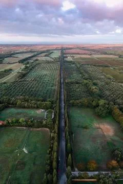 Aerial view of patchwork landscape against cloudy sky 스톡 사진