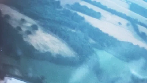 Aerial view of a patchwork landscape featuring a mix of concrete and greenery Video stock 240072872