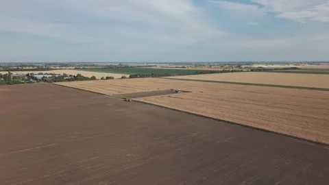 Aerial View of Pea Harvester Working in Large Agricultural Field Stock Footage 340993211