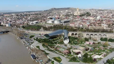 Aerial view of the Peace Bridge and Rike Park in central Tbilisi, Georgia Stock Footage 314697668
