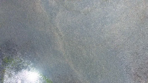 Aerial View of Pebble Beach View, Beautiful Sand and Rock Pebble Sun Lens Flare Stock Footage 97951831