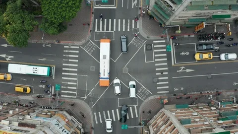 Aerial view of people and traffic crossing busy intersection in Taipei Stock Footage